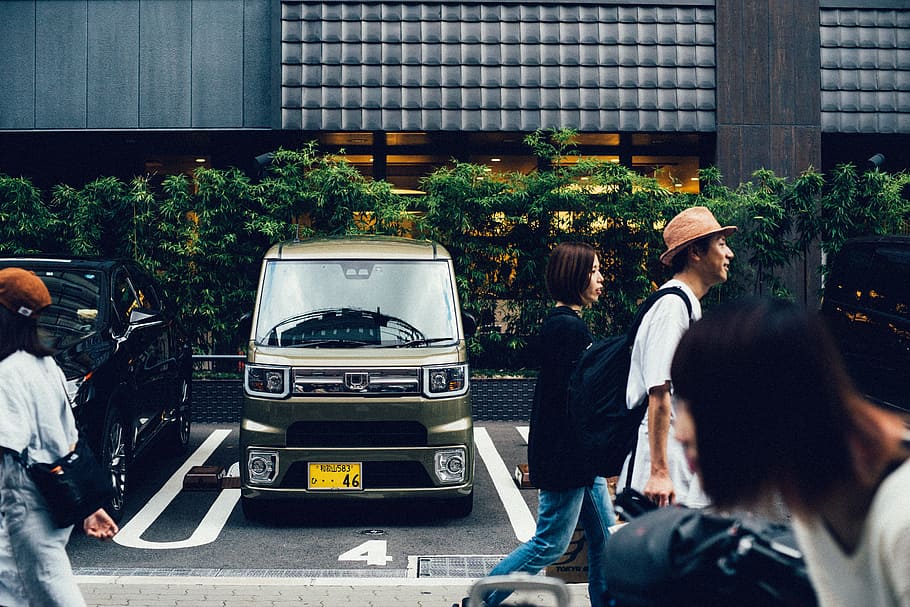 person walking beside gray van, osaka, city, architecture, transportation HD wallpaper