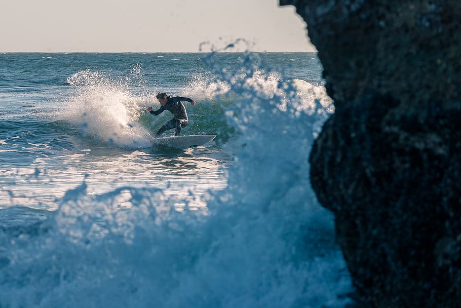 Man Surfing on Body of Water, action, athlete, beach, daytime HD wallpaper