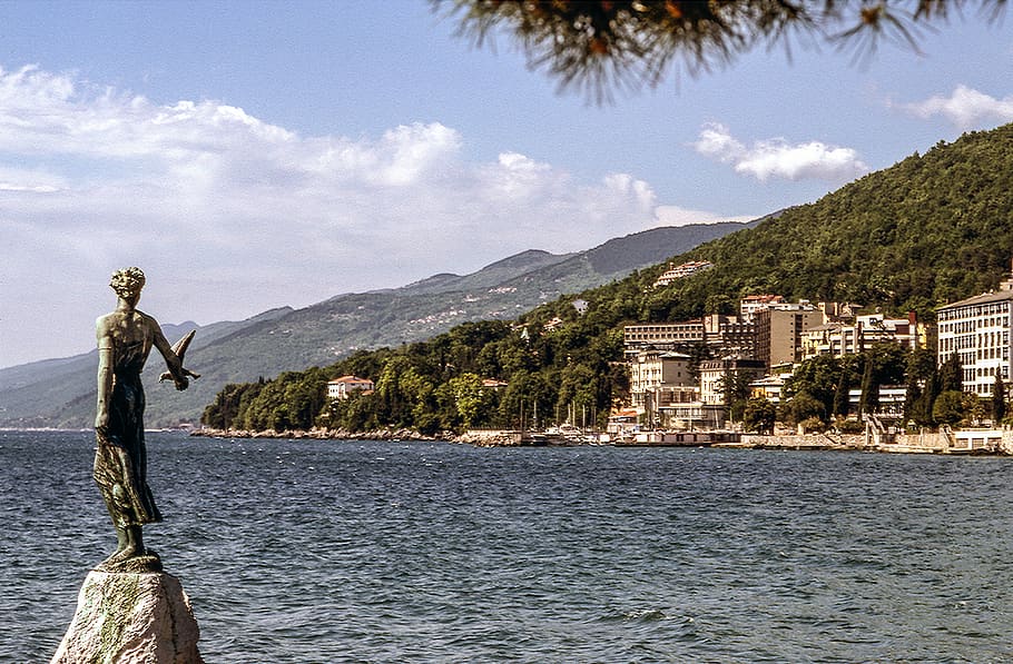 river, water, sky, trees, view, city, mountain, architecture HD wallpaper