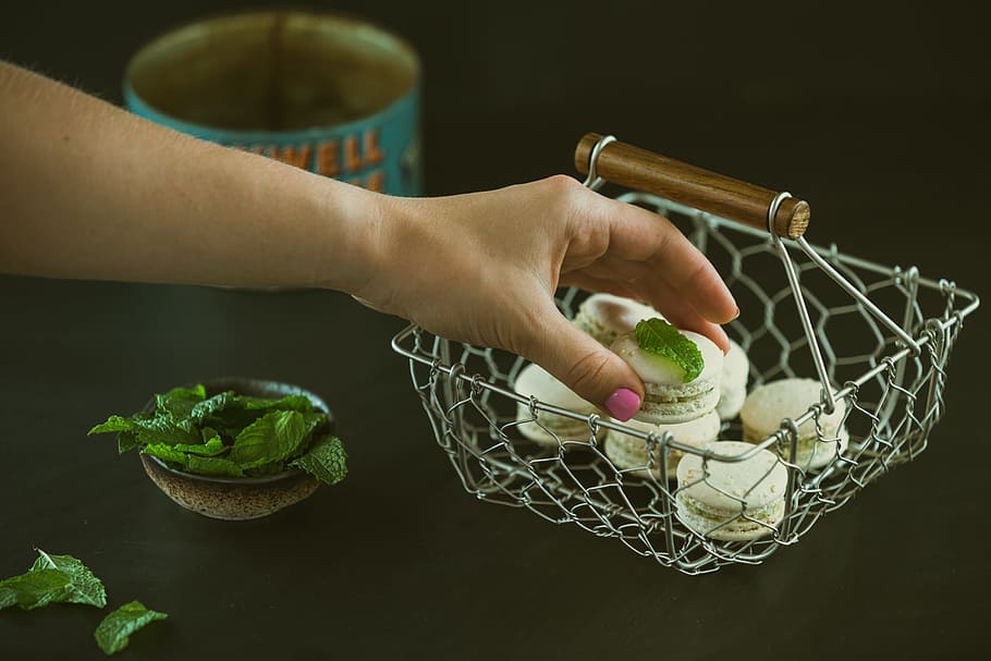 French macarons, sweet, human hand, one person, human body part HD wallpaper