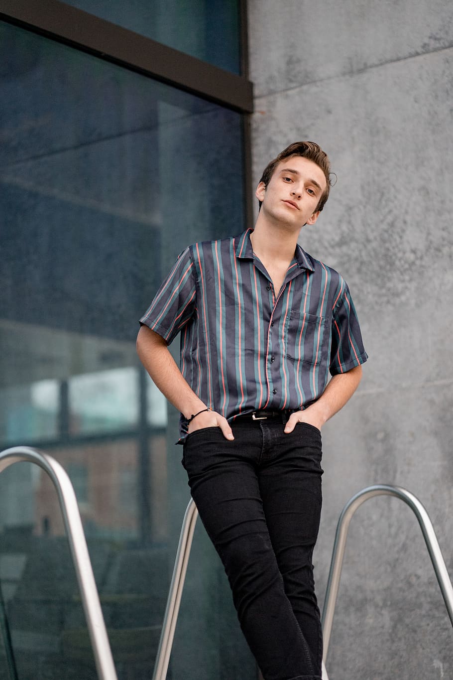 man standing and leaning on railing, three quarter length, one person HD wallpaper
