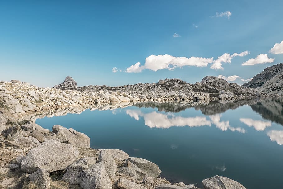 body of water surrounded by rock, lake, reflection, blue sky HD wallpaper