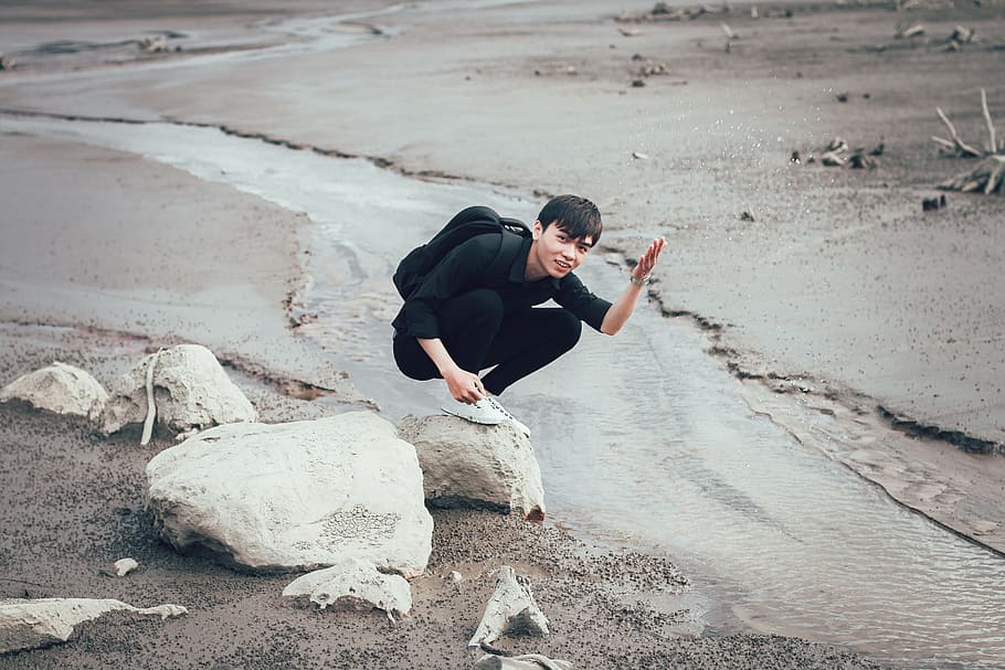 Man Carrying Backpack Near River, alone, black, flood, landscape HD wallpaper