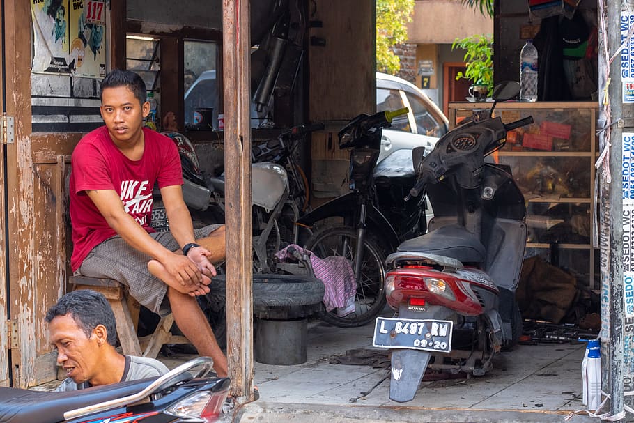 man sitting near motorcycle, person, human, transportation, vehicle