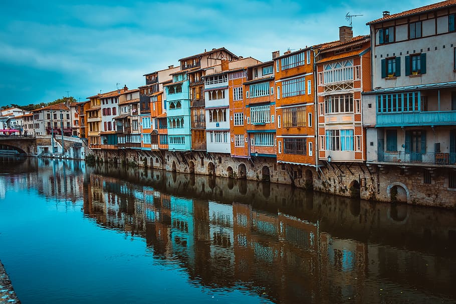 Assorted-color Concrete Buildings Beside River at Daytime, arch HD wallpaper