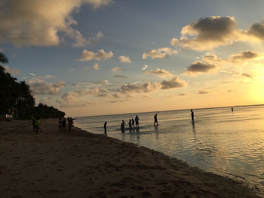 beach, sunset, water, sky, cloud - sky, land, sea, group of people HD wallpaper