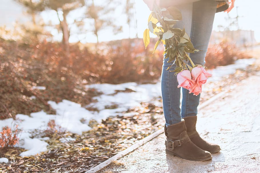Young girl with roses on the street, one person, low section HD wallpaper