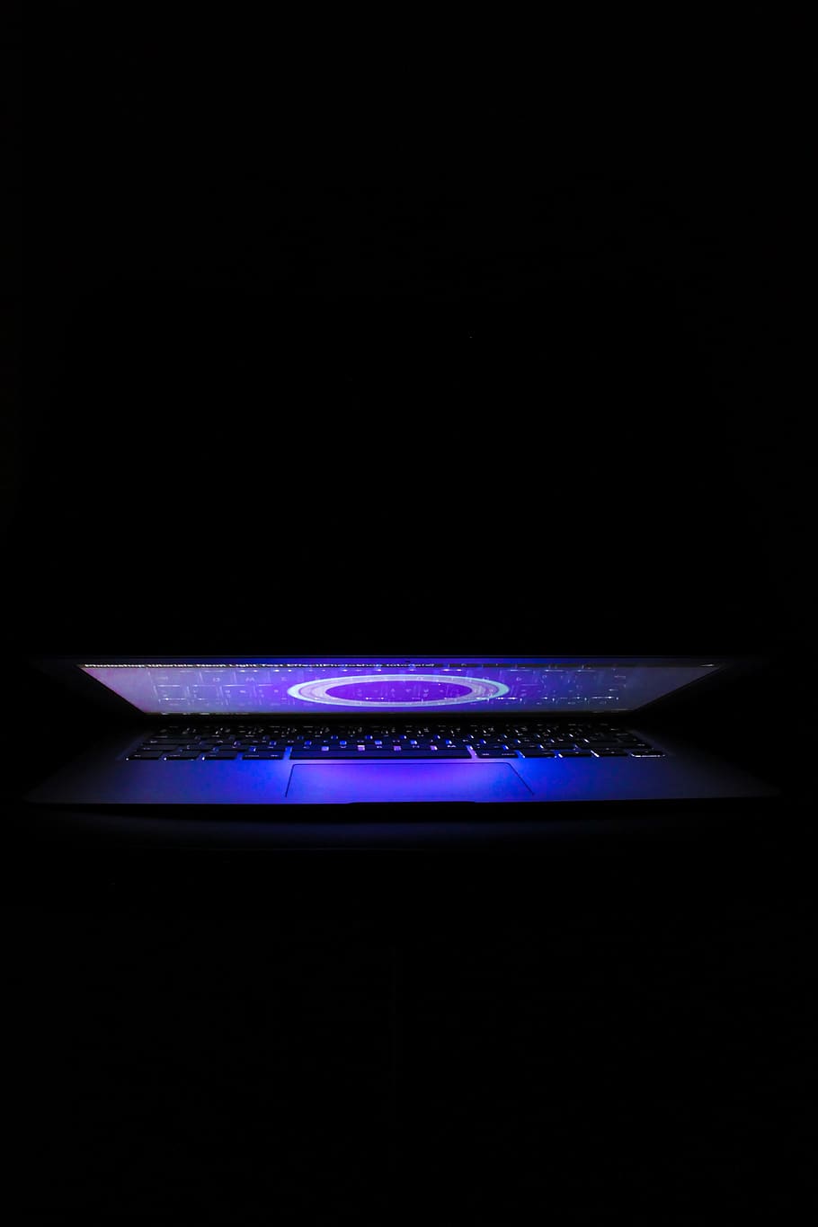 slightly opened laptop computer, blue, black background, indoors HD wallpaper
