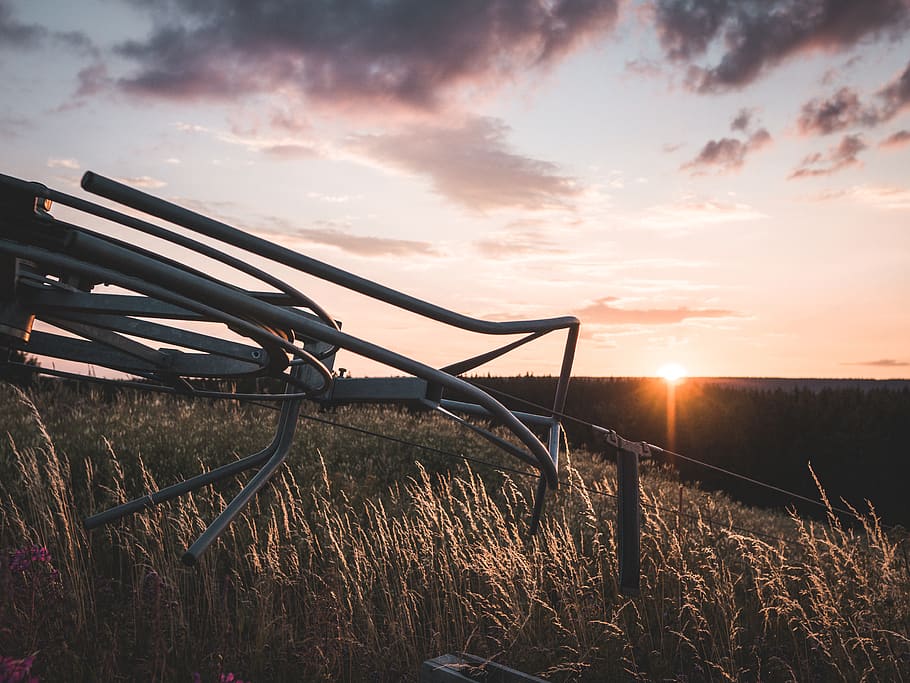Grey Steel Farm Machine on Field during Orange Sunset, clouds HD wallpaper