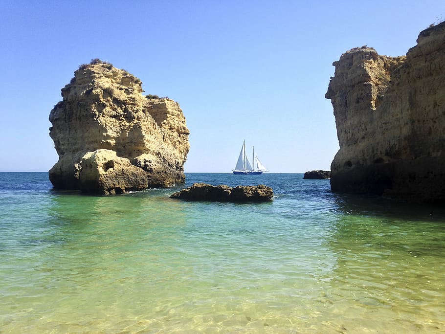 sailboat, rocks, cliffs, coast, water, sea, rock - object, rock formation HD wallpaper