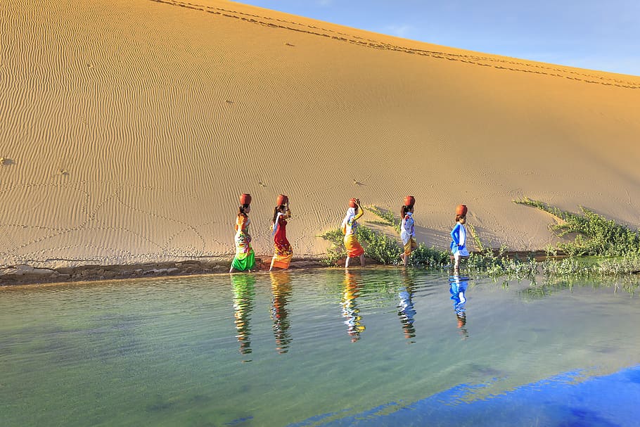 Women Walking on Body of Water, daylight, dune, fun, jars, landscape HD wallpaper