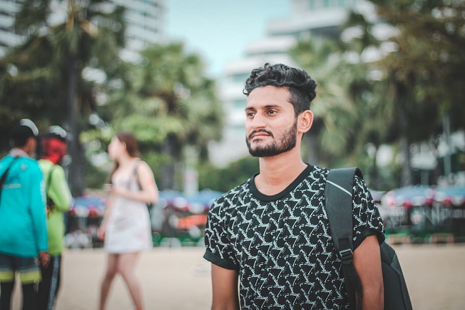 Man in Black and White Crew-neck Shirt Wearing Black Backpack HD wallpaper
