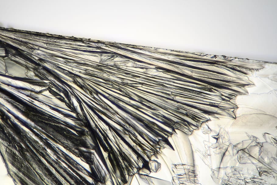 Crystals forming in solution viewed through the microscope, background