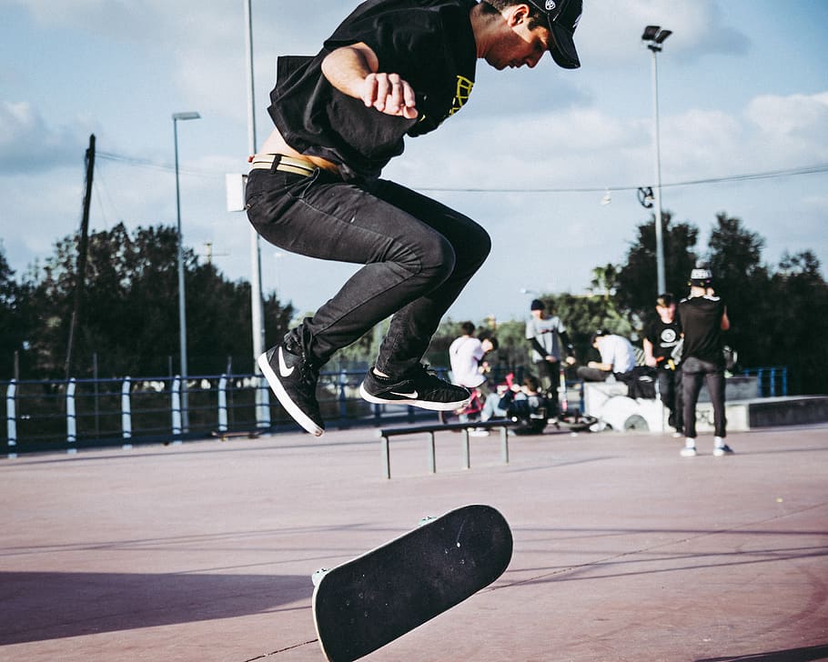 skateboarding man during daytime, jumping, mid-air, one person HD wallpaper