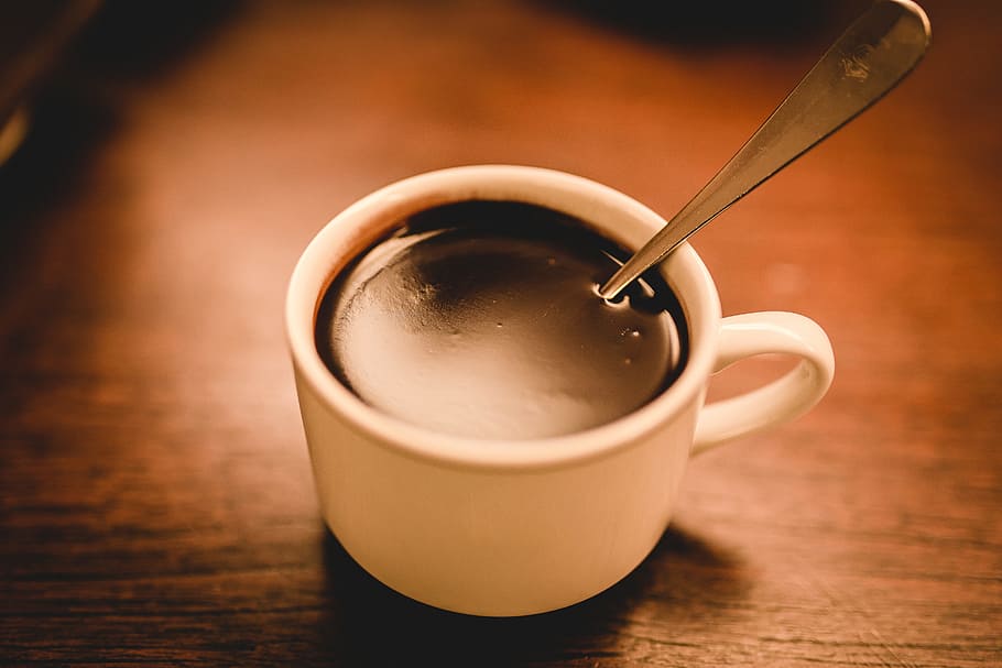 White Ceramic Espresso Cup Filled With Coffee On Brown Wooden Surface HD wallpaper