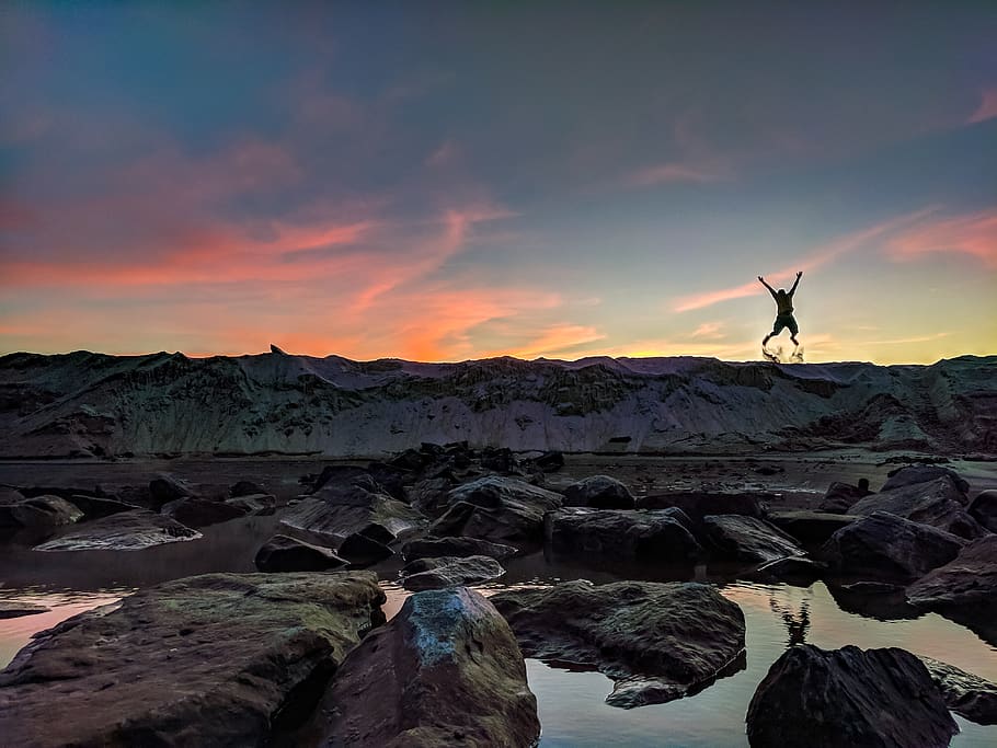 Person Jumping on Mountain Photo, adventure, beach, clouds, dawn HD wallpaper