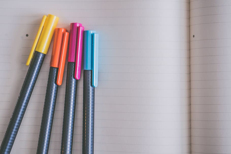 Yellow, Orange, Pink, and Blue Coloring Pens on White Notebook, HD wallpaper