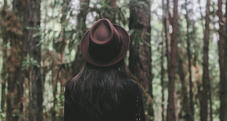 person wearing hat facing trees, forest, rear view, one person HD wallpaper