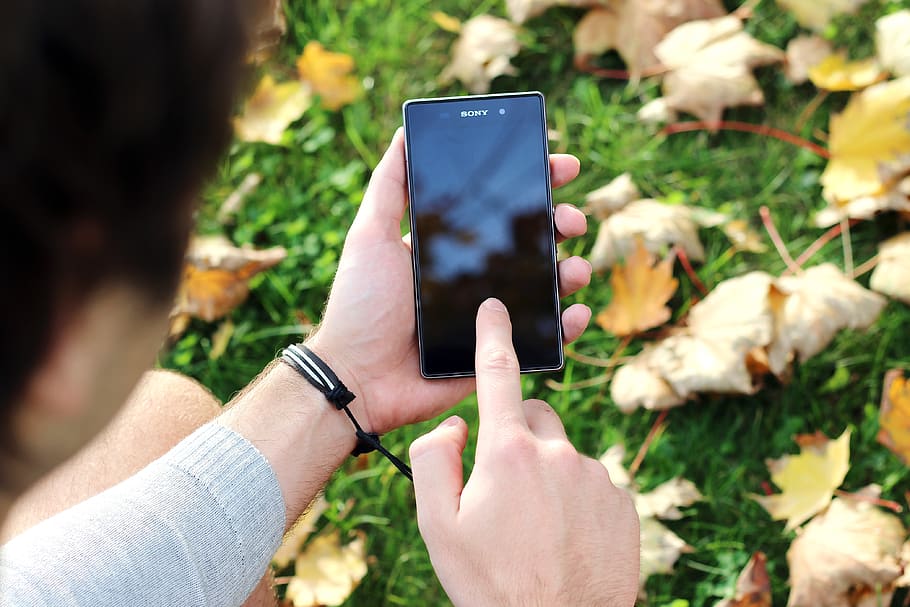 Person Using the Black Sony Android Smartphone, hand, mockup HD wallpaper