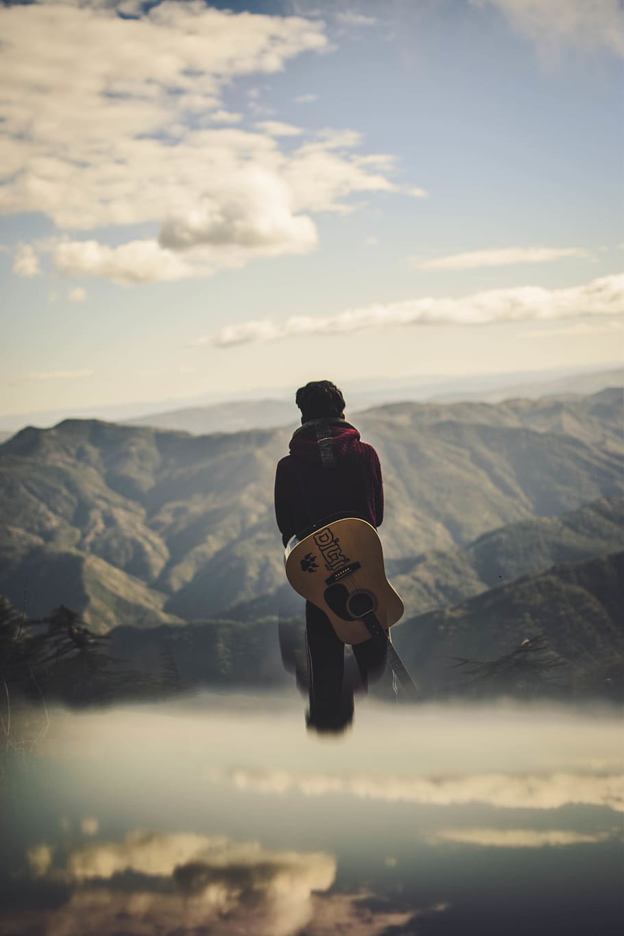 Man Carrying Guitar While Standing Starring at the Hills, adventure