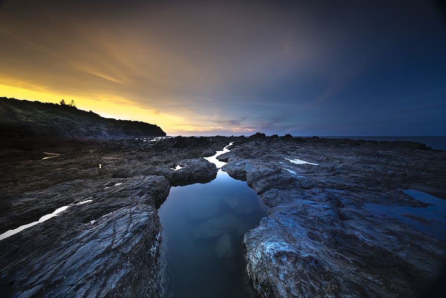 Body of Water With Rock Formation, backlit, clouds, dawn, dusk HD wallpaper