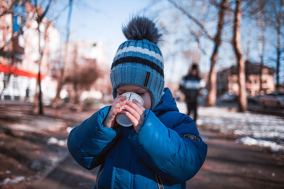boy holding white cup, apparel, clothing, person, human, cap HD wallpaper