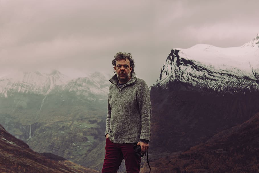 Mountain clothes. Man standing in Deep Forest hq pictures.