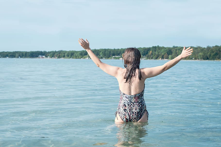 Woman in Body of Water, back view, beach, enjoyment, dom, fun HD wallpaper