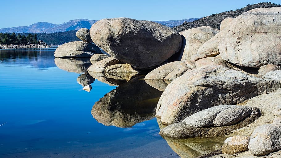 Gray Rock Formation Reflecting on Body of Water, boulders, clouds HD wallpaper