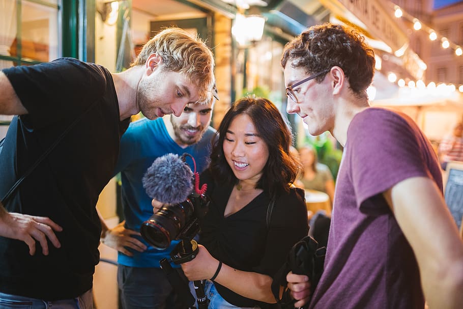 Three Men Watching Camera Holding by a Woman, close-up, colleagues HD wallpaper