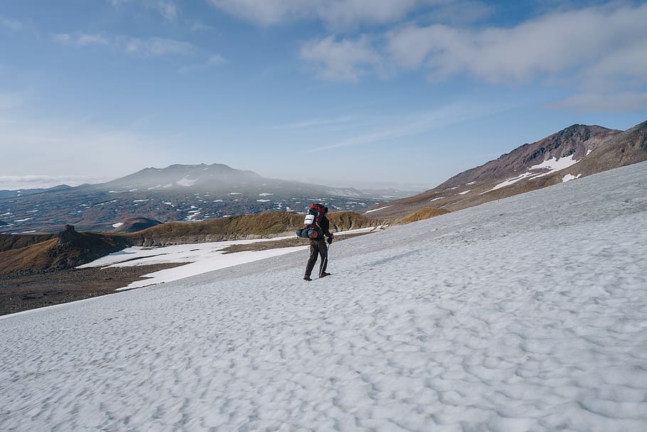 man walking on snow, nature, outdoors, mountain, mountain range HD wallpaper