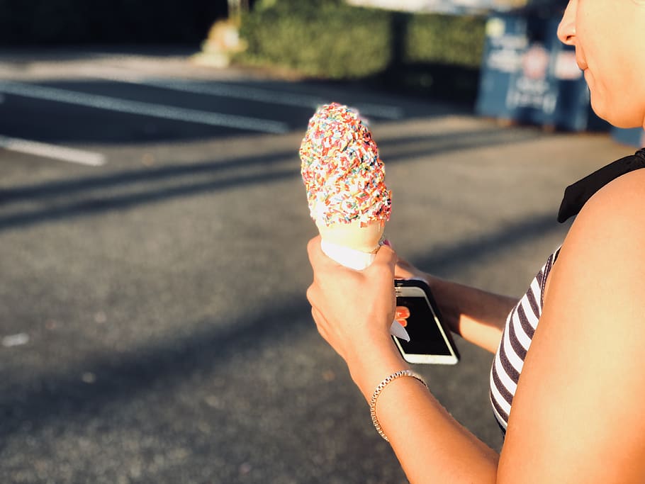 Woman Holding Ice Cream in Cone, blur, blurred background, cellphone HD wallpaper