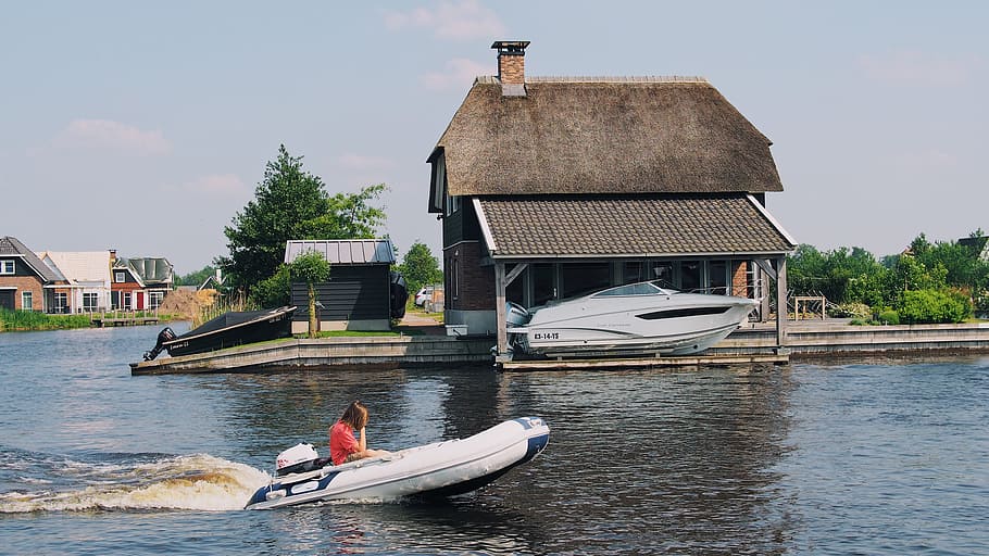 Person on White Inflatable Speed Boat, architecture, daylight HD wallpaper