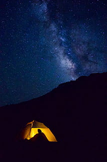 yellow lighted camp within mountain range during nighttime, tent HD wallpaper