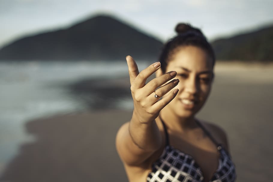 Woman Showing Her Right Hand at the Beach, blur, daylight, depth of field, HD wallpaper