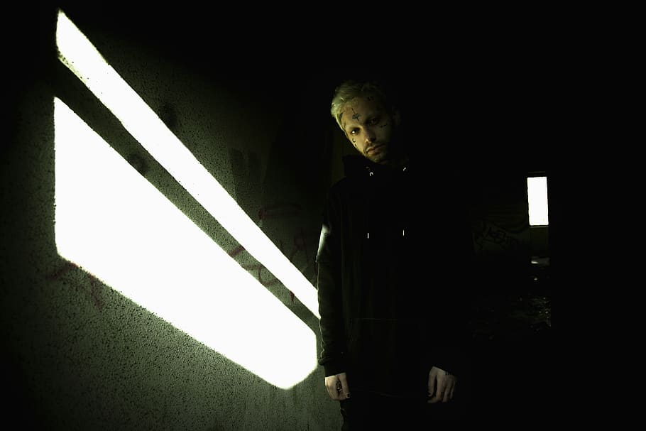 man wearing black coat, one person, night, sign, standing, real people HD wallpaper