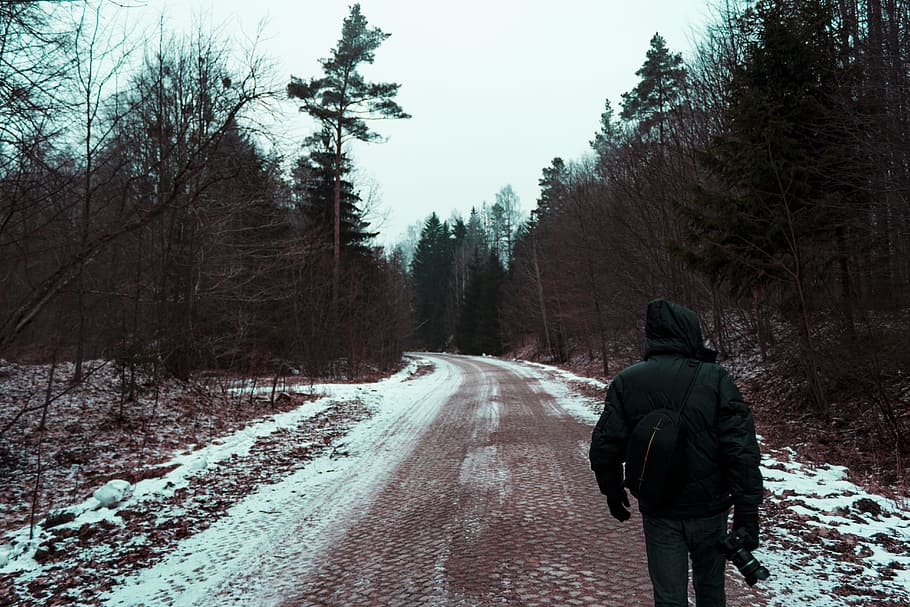 Person in Black Hoodie Top and Black Pants on the road holding a camera HD wallpaper