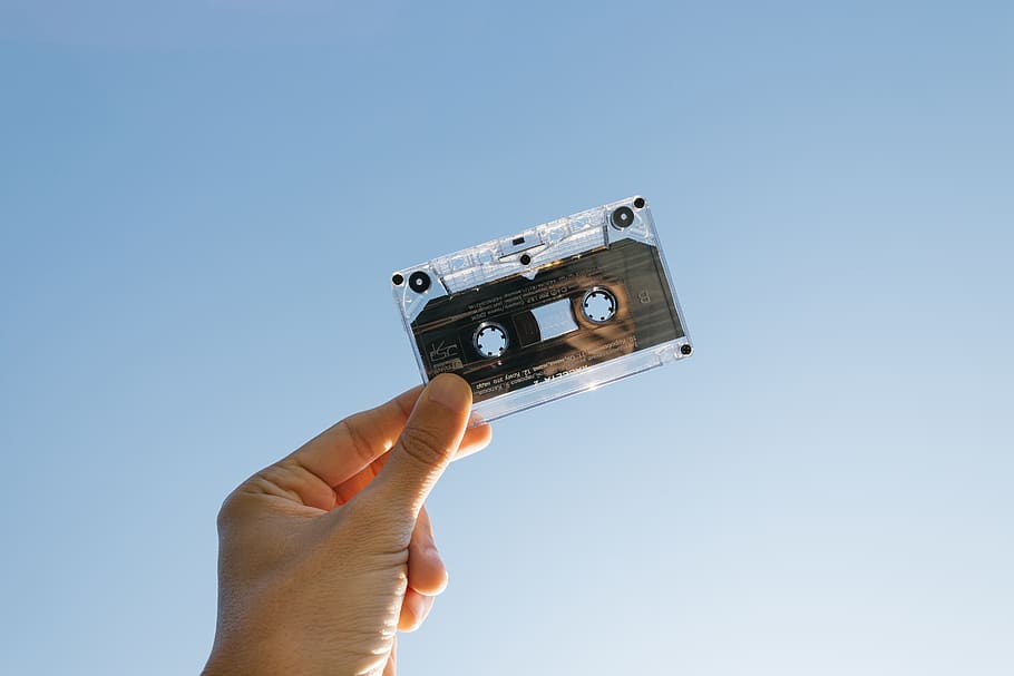 Person Holding Cassette, Analogue, audio, cassette tape, clear sky
