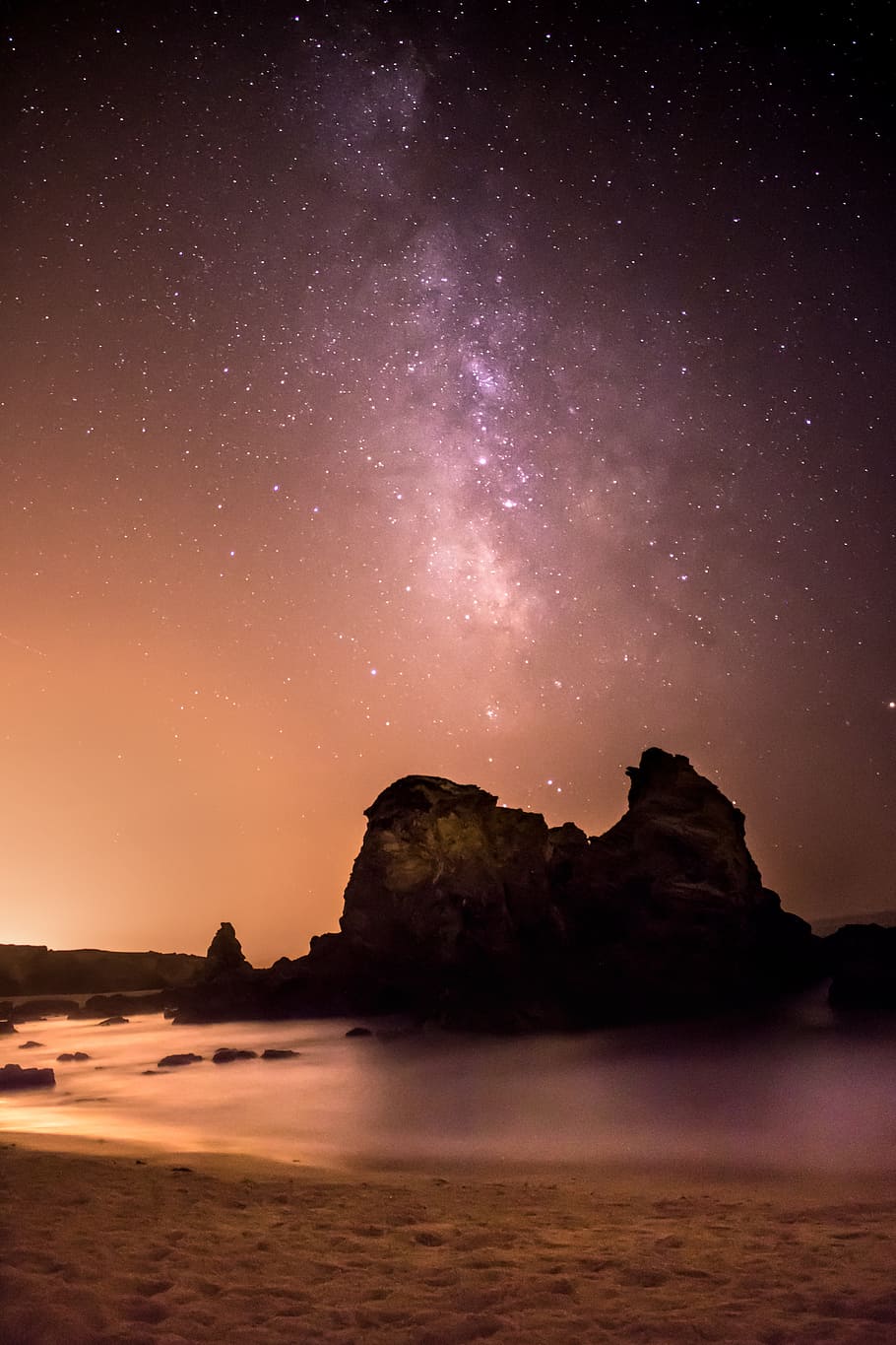 rock formation surrounded by water under black and white milky way HD wallpaper