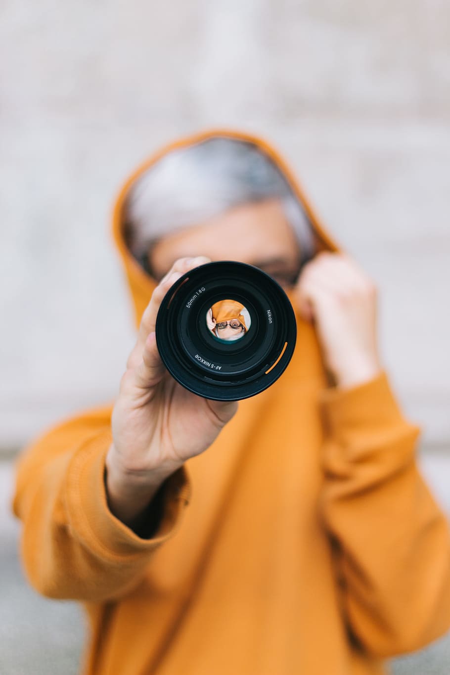 view of person in yellow hoodie holding camera lens, street, kid HD wallpaper
