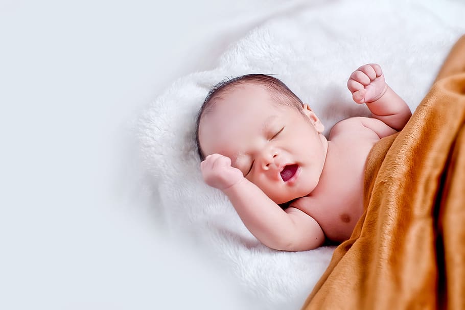 Baby Lying On White Fur With Brown Blanket, adorable, child, cute