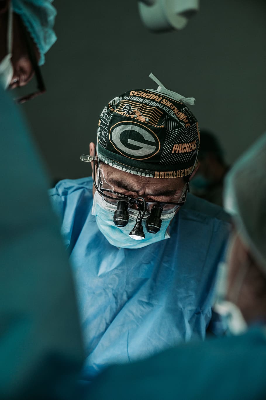 doctor wearing Green Bay Packers hat, men, healthcare and medicine