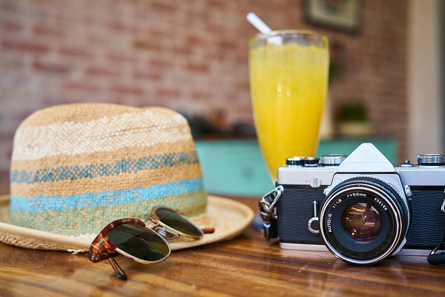 Gray and Black Dslr Camera Beside Sun Hat and Sunglasses, classic HD wallpaper