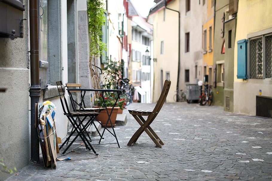 black table with chairs on pathway, building exterior, architecture HD wallpaper