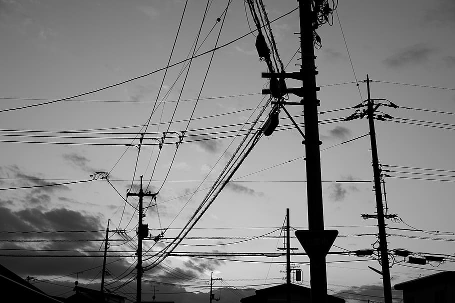 transmission post during golden hour, utility pole, cable, wire