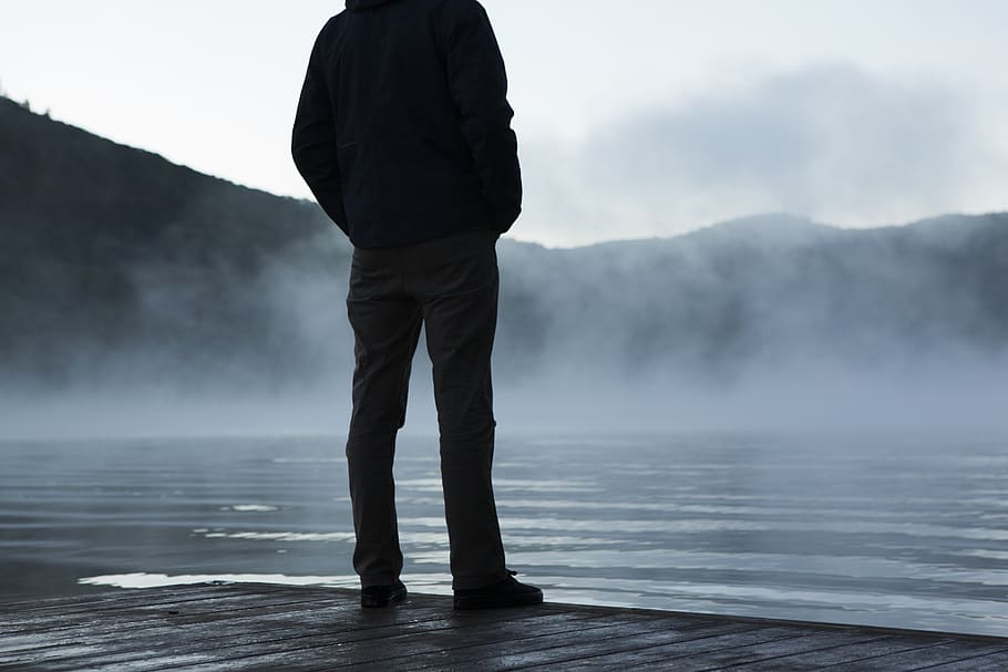 man, guy, person, standing, wood, dock, water, ripples, fog HD wallpaper