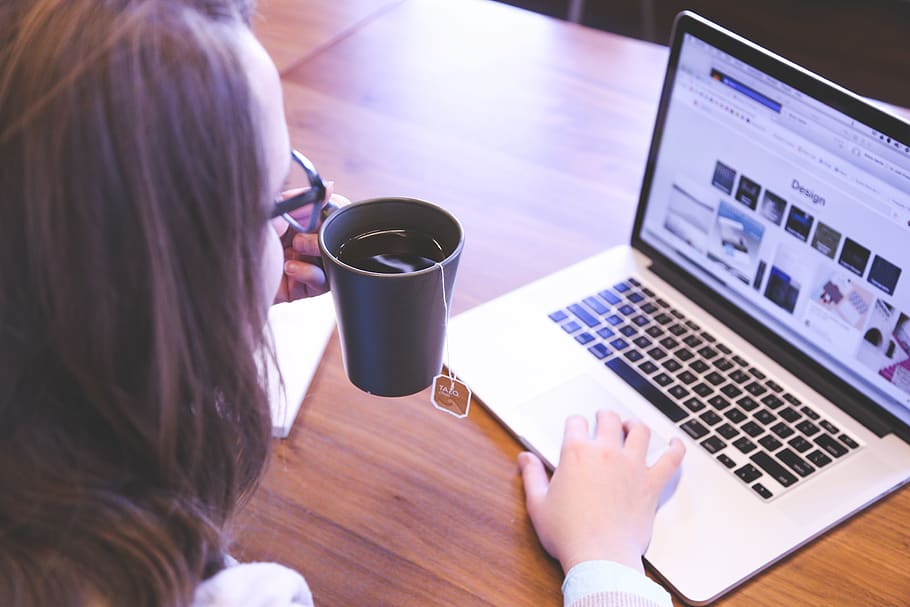 Person Holding Mug While Using Laptop, apple, browsing, cup, desk HD wallpaper