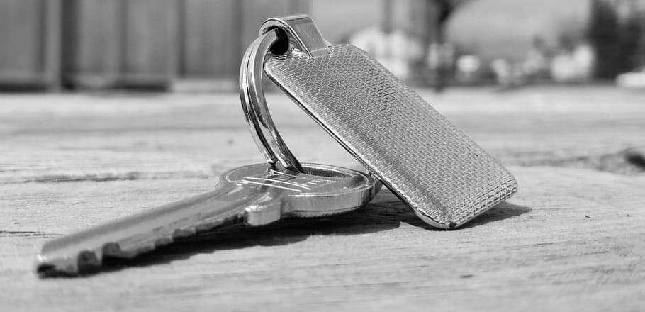 Silver Key on Floor, black-and-white, close-up, conceptual, focus