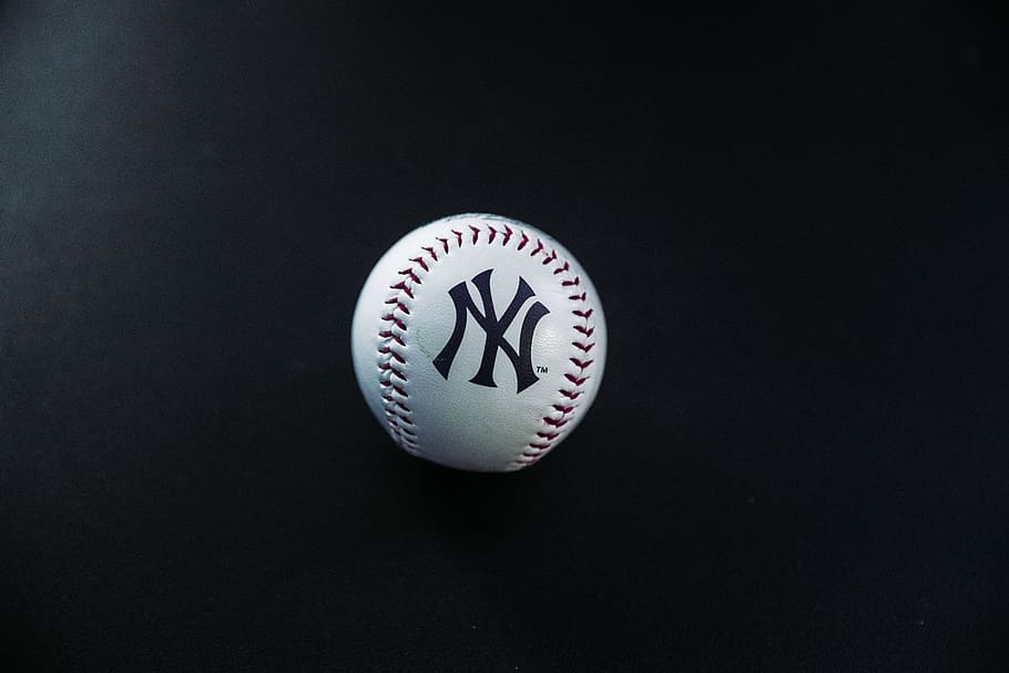 Public Domain. white and red New York Yankees baseball on black surface, cl...