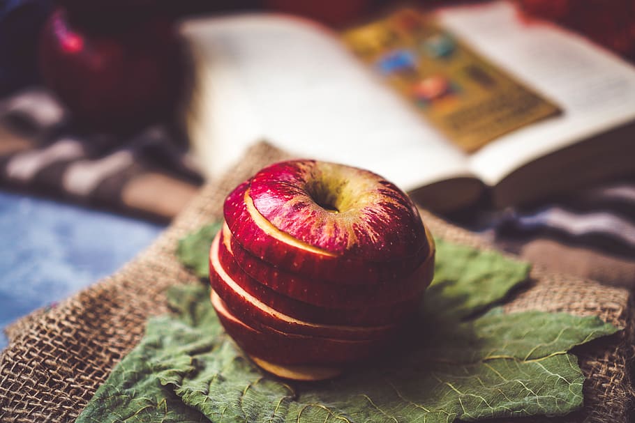 sliced apple fruit on green textile, produce, plant, food, flora HD wallpaper
